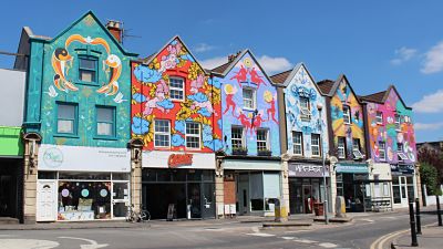 Row of houses with murals in North Street